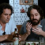 Eric Belhassen e Caco Ciocler em cenas do filme 'AmarAção'