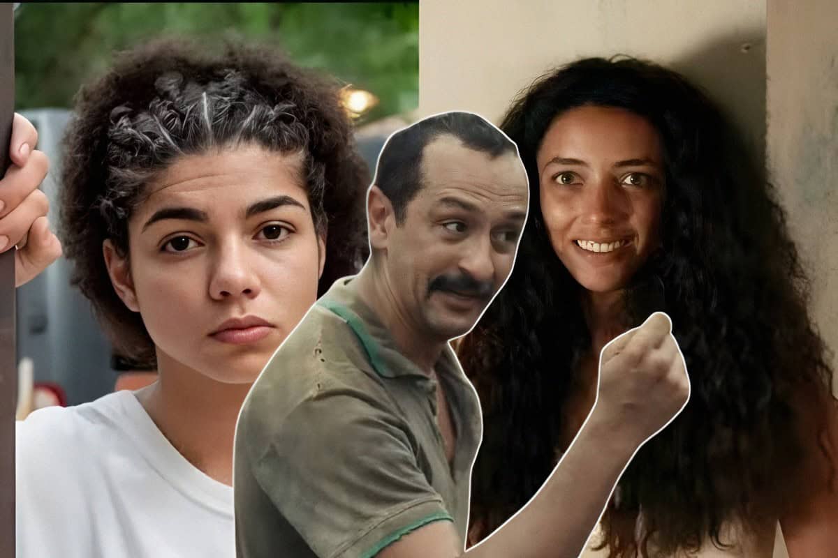 Joana e Tião se encaram em clima de tensão, com Zinha observando-os ao fundo.