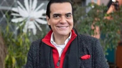 Imagem de Fábio Arruda em evento público, mostrando sua característica elegância e carisma