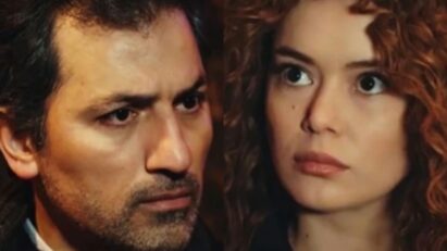 Sirin com expressão fria segurando uma arma na sala do apartamento de Enver, cena tensa da novela Força de Mulher.