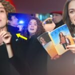 Imagem de Bahar no palco: Bahar dá palestra emocionada diante de multidão.